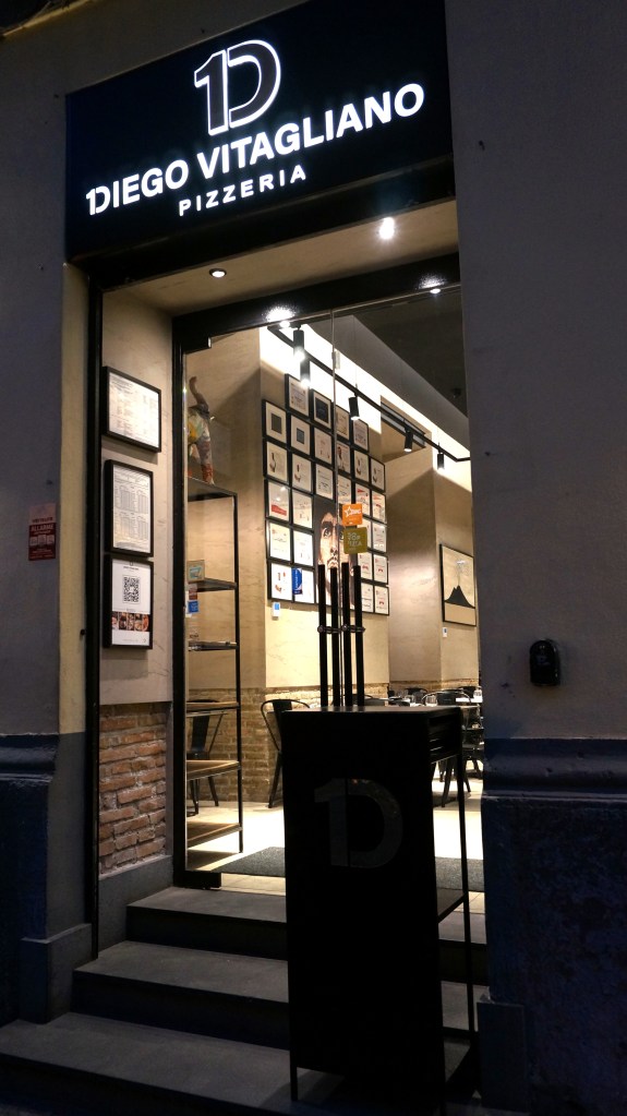 The Santa Lucia location of Diego Vitagliano Pizzeria in Naples, Italy at night.