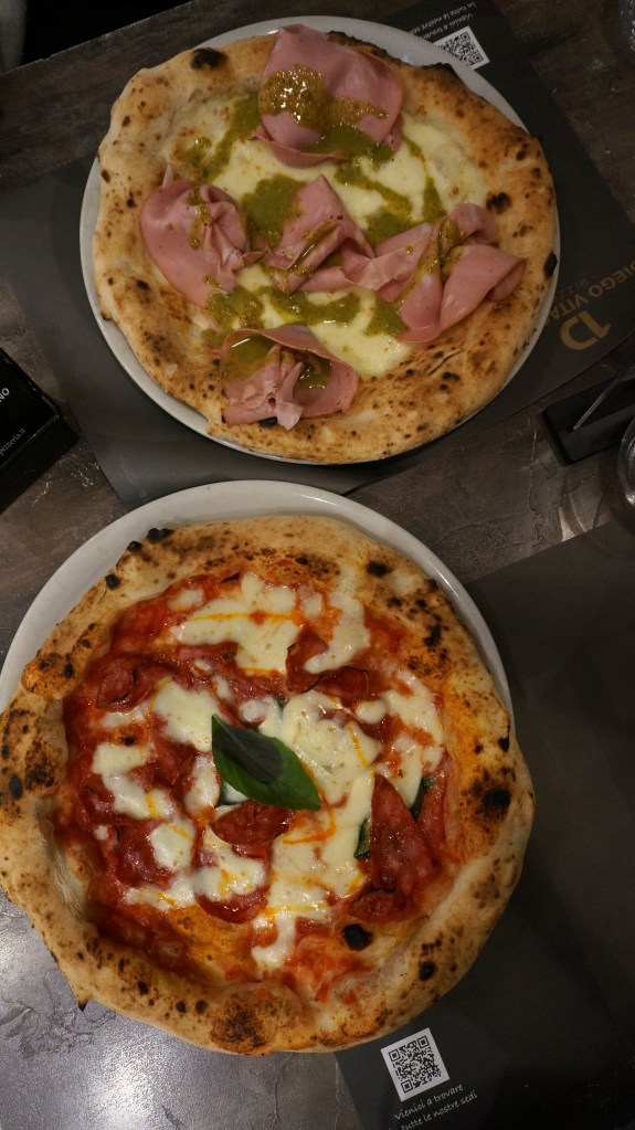 The Diavola pizza and the Pistadella pizza side by side from Diego Vitagliano Pizzeria.